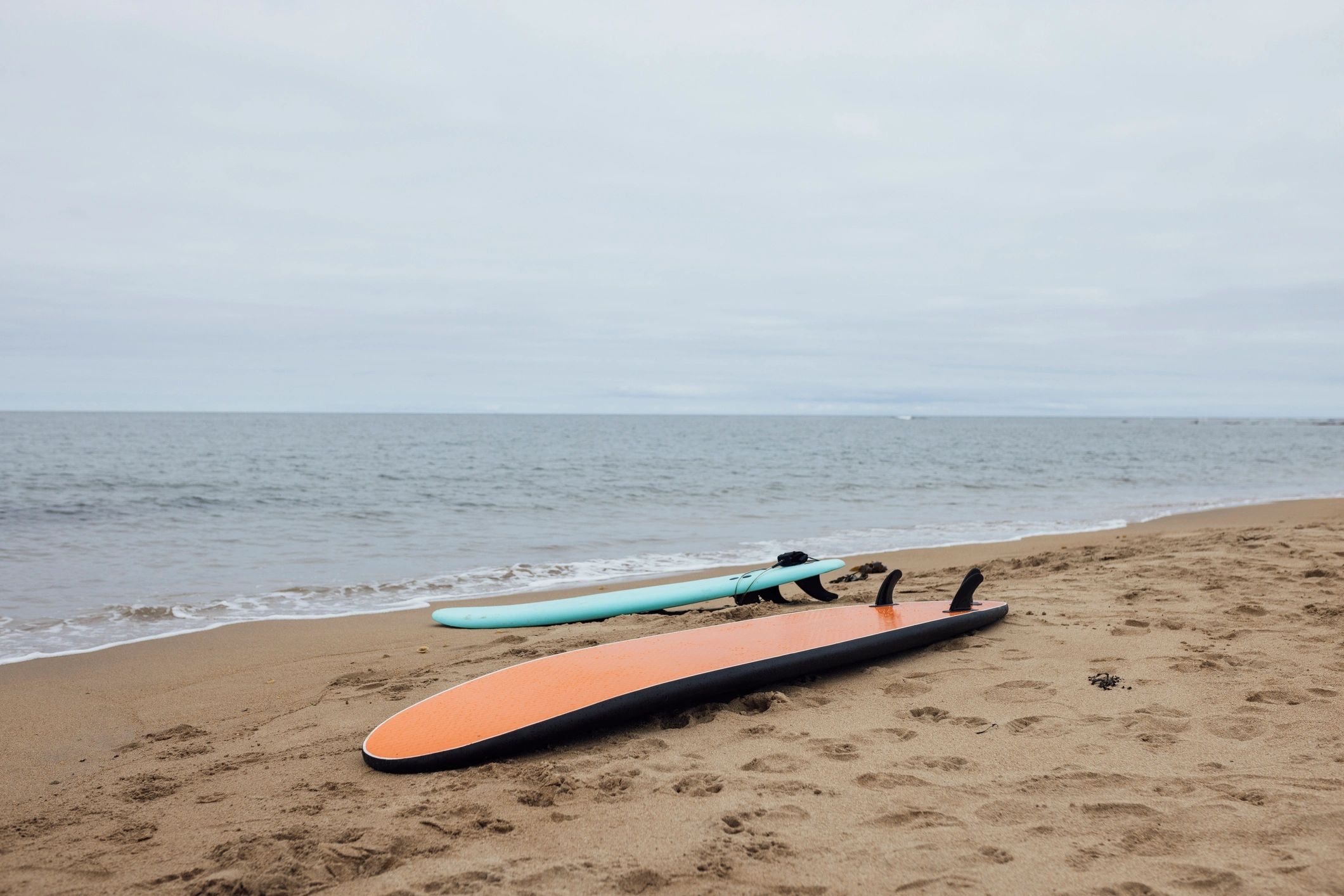 Surfboards on the sand at the shore